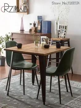 Индивидуална облегалка на скандинавския стола с едно лесно луксозен кожен трапезария стол За домашна вечеря Прост съвременен желязо писмен стол